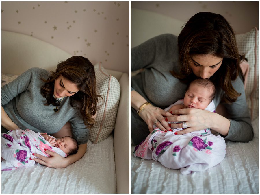 photo of mother looking at newborn that is on a daybed at home session swaddled in wrap