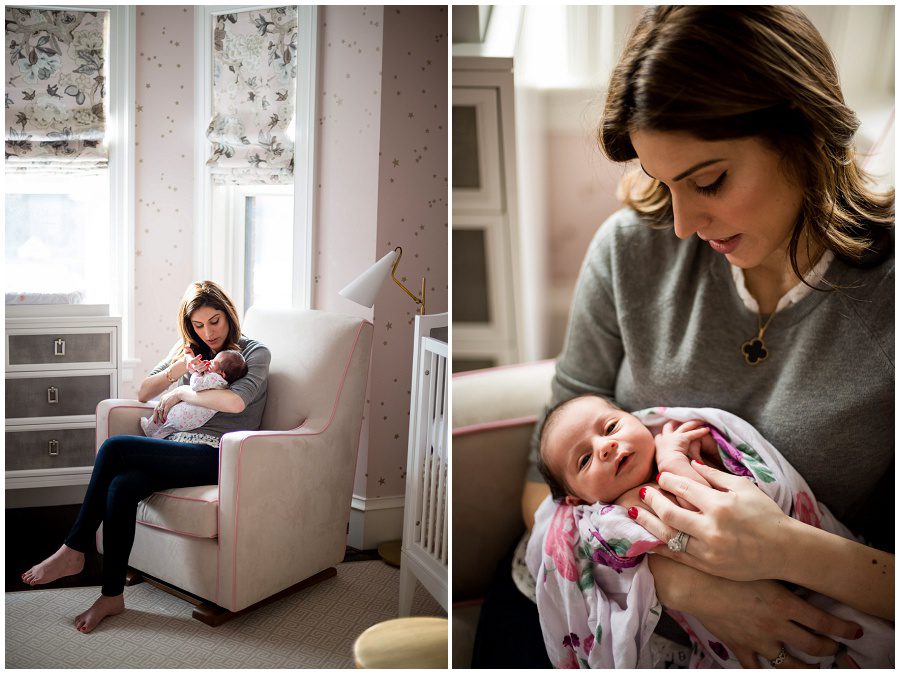 Mother soothes her newborn baby as she sits in a rocking chair in her nursery