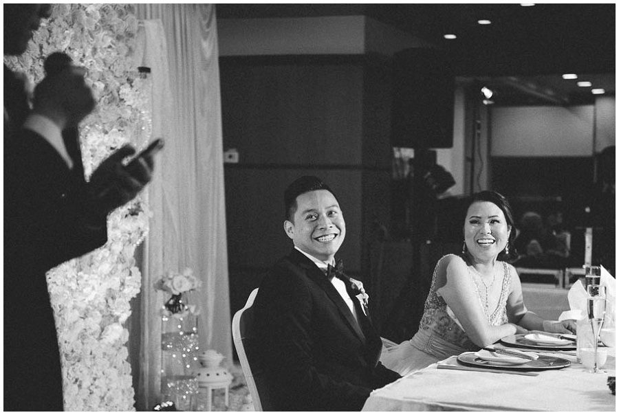 groom and bride reacting to speech by best man at hei la moon