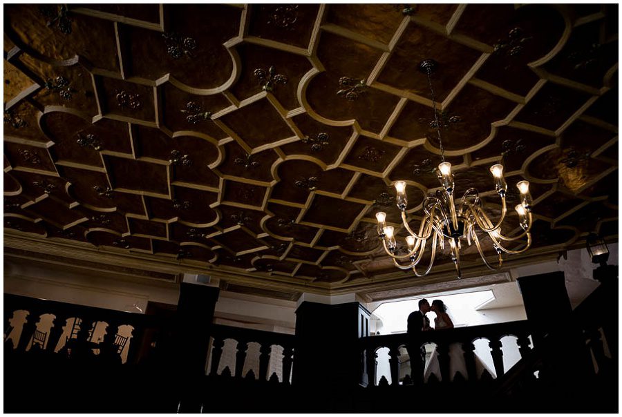 bride and groom kissing during portraits at Alden Castle in Boston Longwood Wedding Venue 