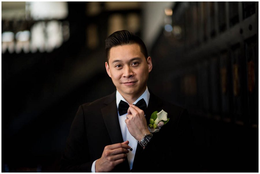 groom adjusting bow tie at Alden Castle in Boston Longwood Wedding Venue 