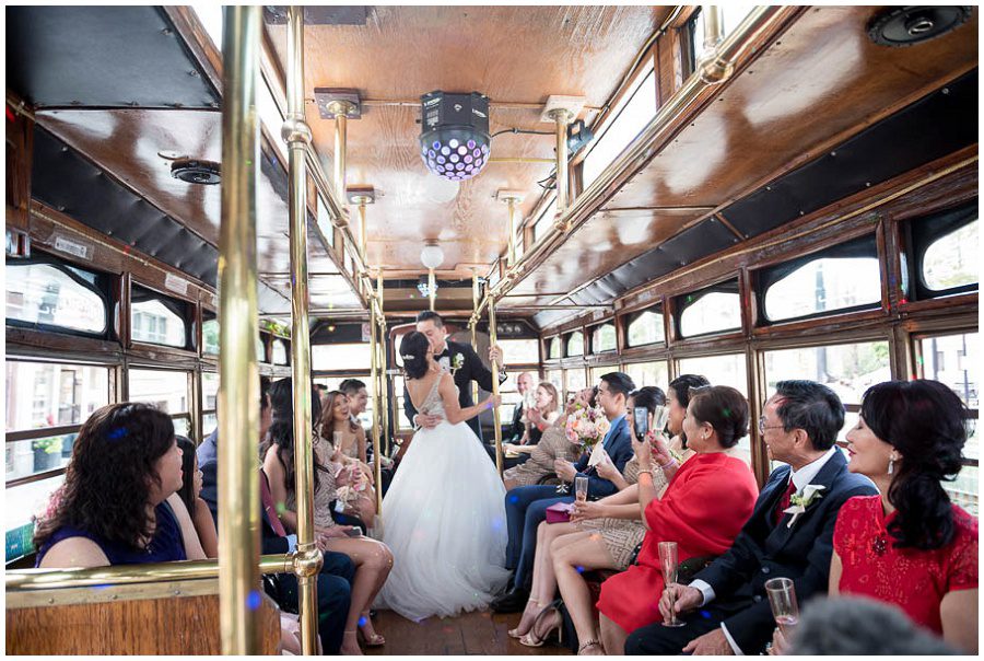 bride and groom trolley portraits heading downtown Boston