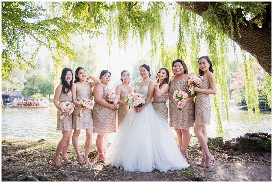 Bride and her bridesmaids portraits during the afternoon in the summer at Boston Public Gardens by a tree