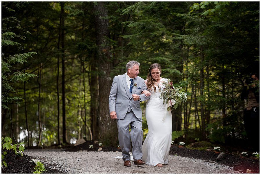 Bride and her father approaching ceremony during processional Sweet Pea Floral Designs www.sweetpeafloraldesignsme.com Hair and makeup by sarah depault www.sarahdepaultbeauty.com and Noel Sarazin Dress by Ve' Lace Bridal and Allure