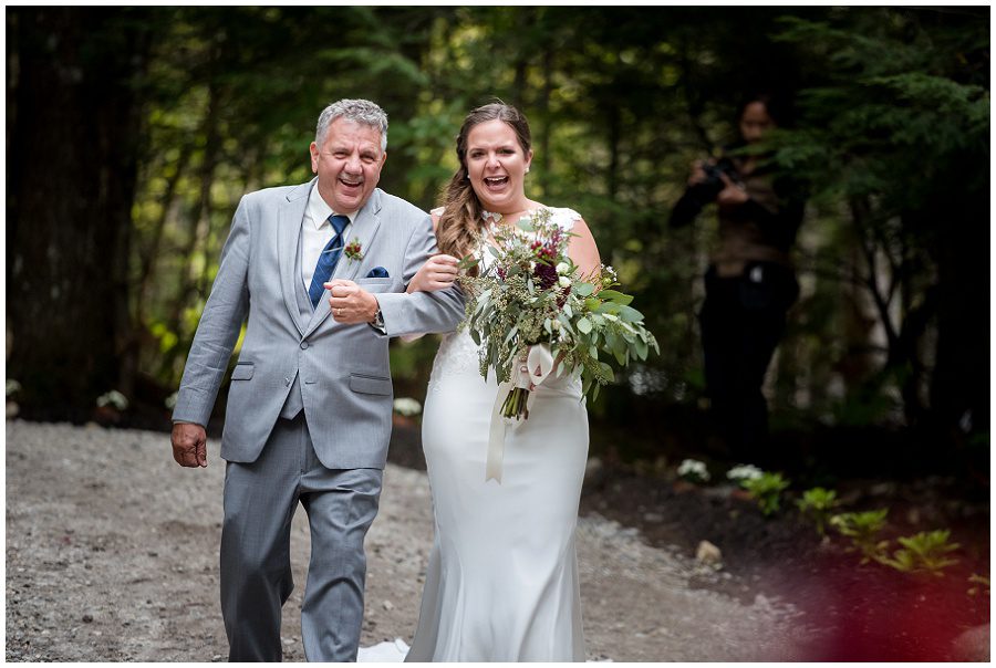 Bride and her father approaching ceremony during processional Sweet Pea Floral Designs www.sweetpeafloraldesignsme.com Hair and makeup by sarah depault www.sarahdepaultbeauty.com and Noel Sarazin Dress by Ve' Lace Bridal and Allure