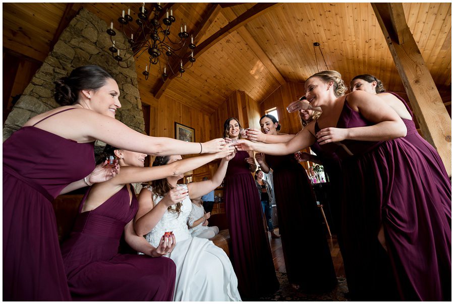 Bride taking shots at wedding prep at Granite Ridge Estate & Barn Wedding