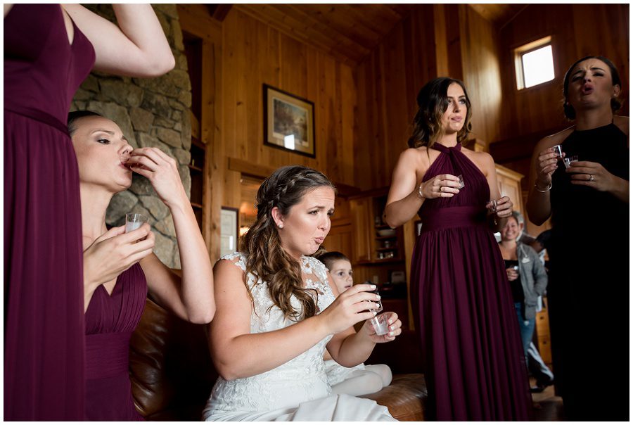 Bride taking shots at wedding prep at Granite Ridge Estate & Barn Wedding