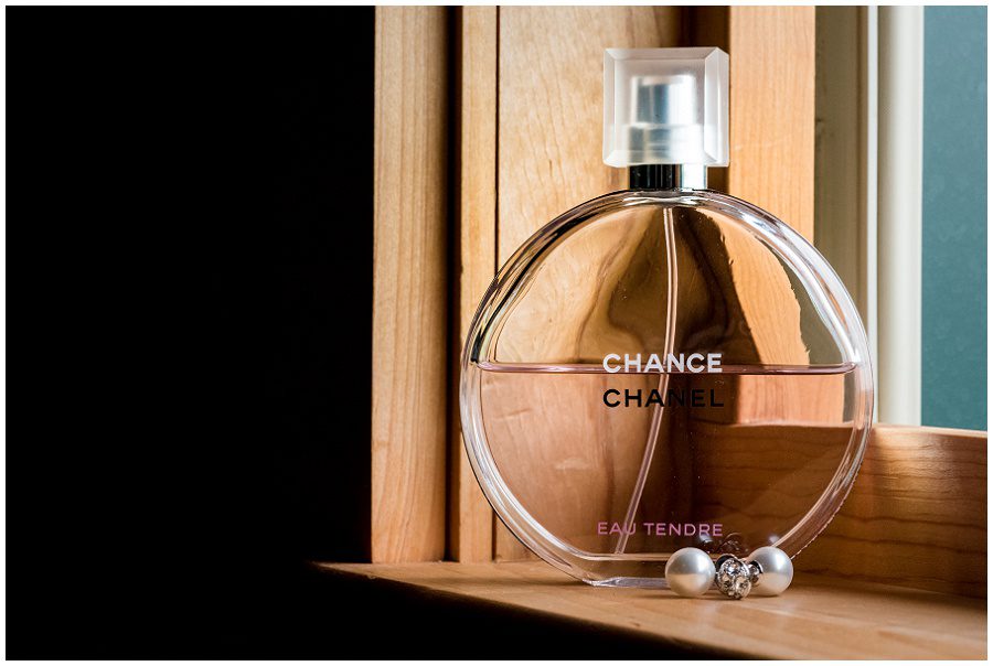 hance chanel perfume bottle and pearl earrings