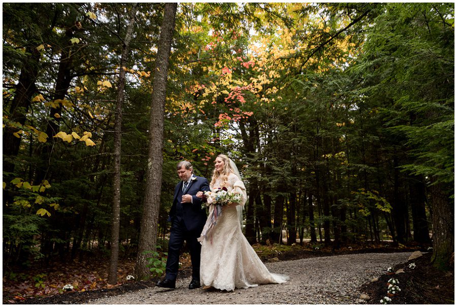 Father of bride walks bride coming down the aisle