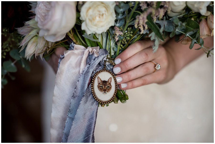 cat emblem incorporated into bridal bouquet