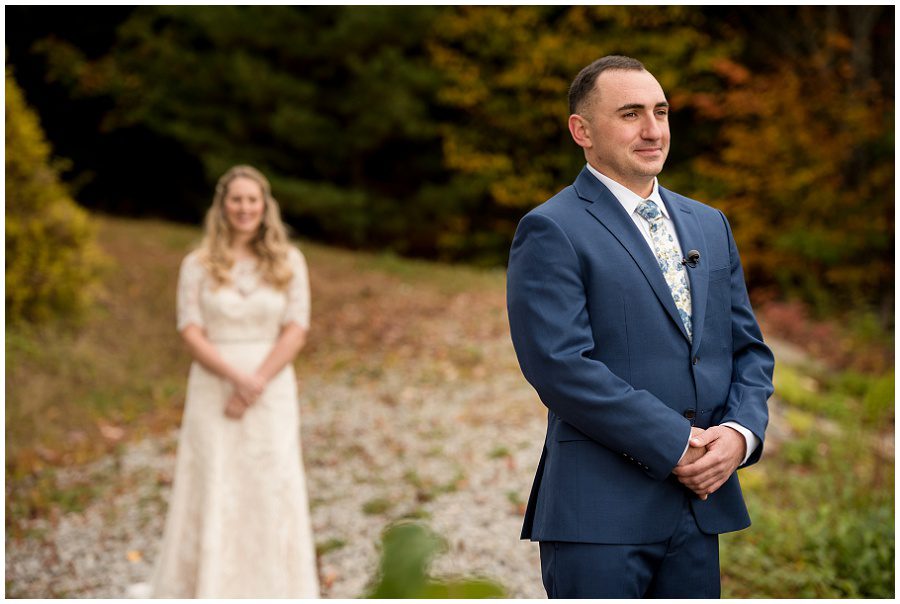 First look moment focus on the groom at Granite Ridge Estate and Barn in Norway Maine