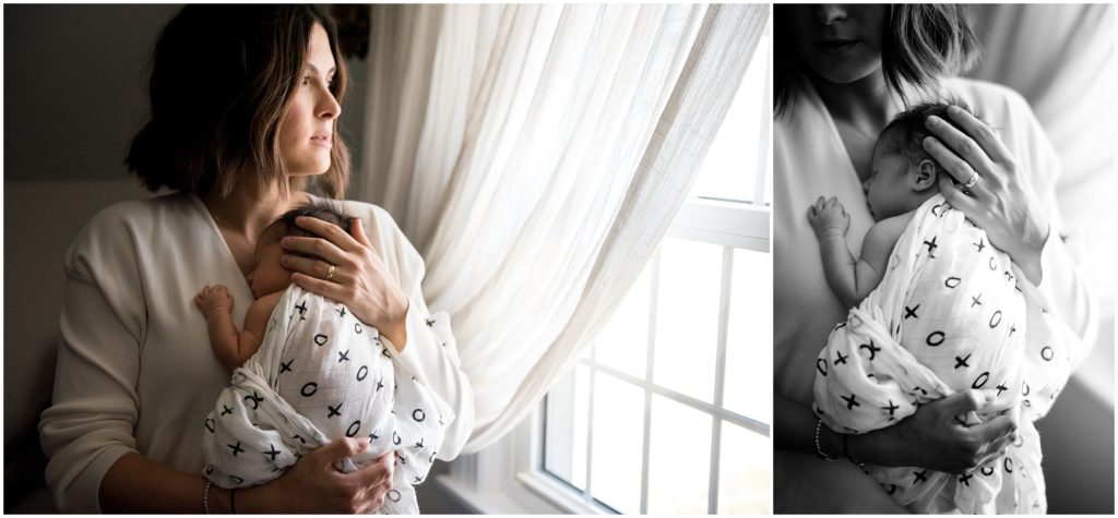 newborn held in mother's hands
Black and white image