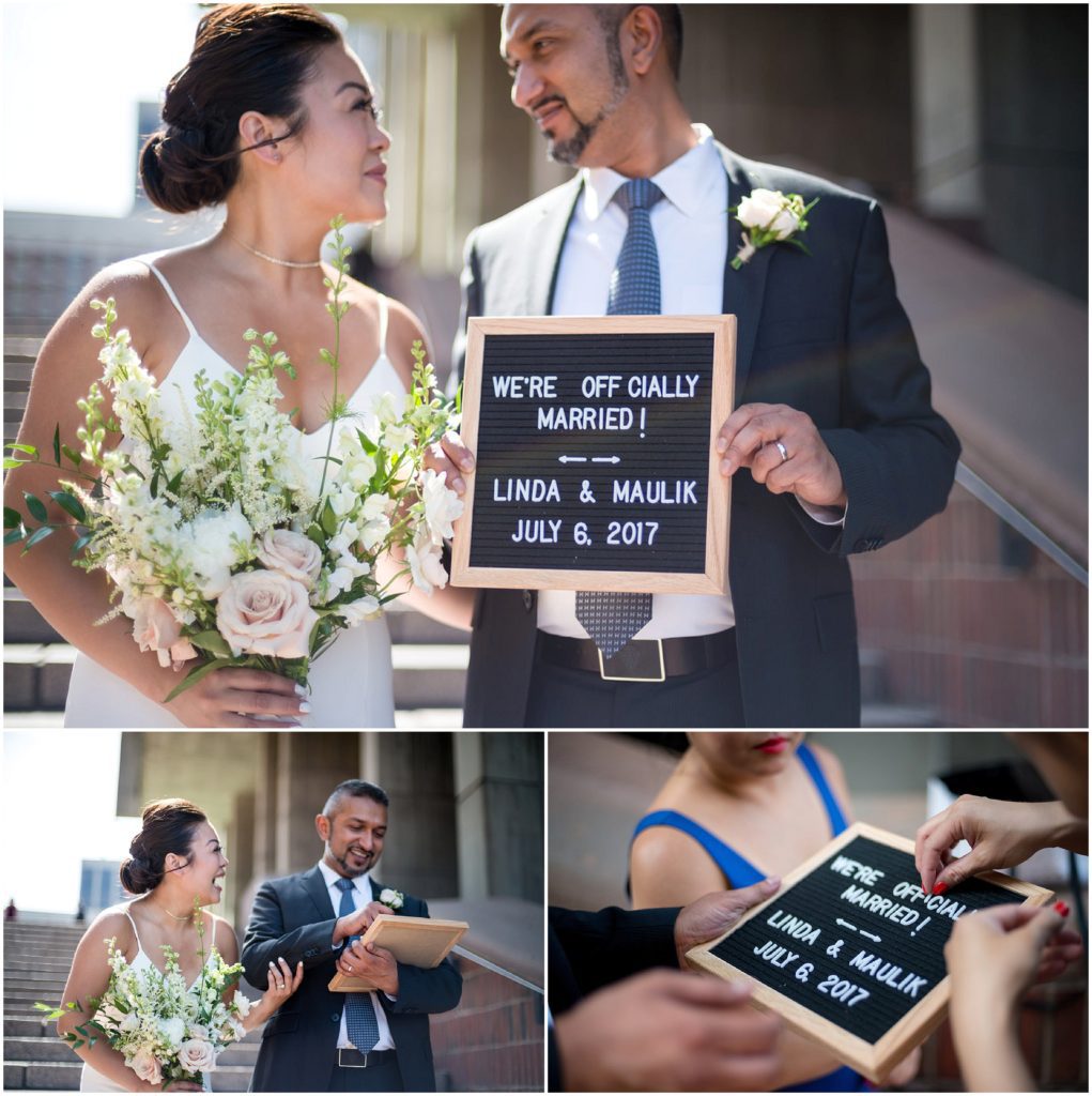 Newlyweds outside Boston City Hall with just married sign