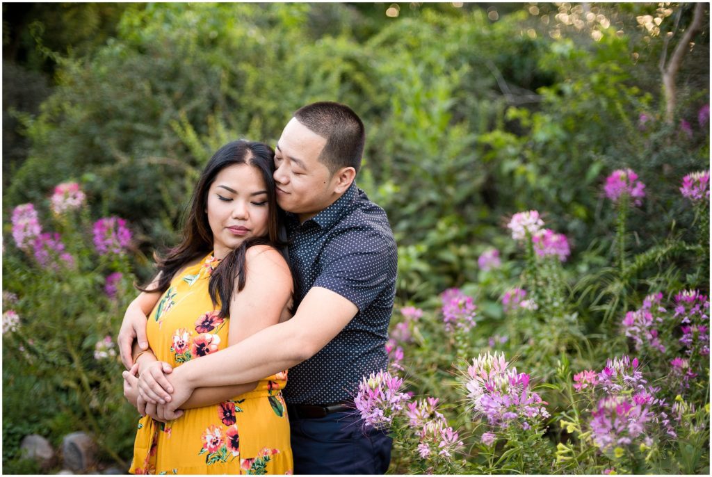 Engagement Photos at The Fens in Boston with spring blossoms in a garden