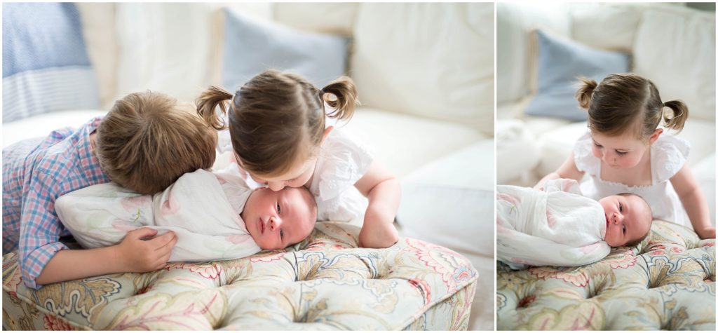 Older siblings kissing baby sister on chair in New England home