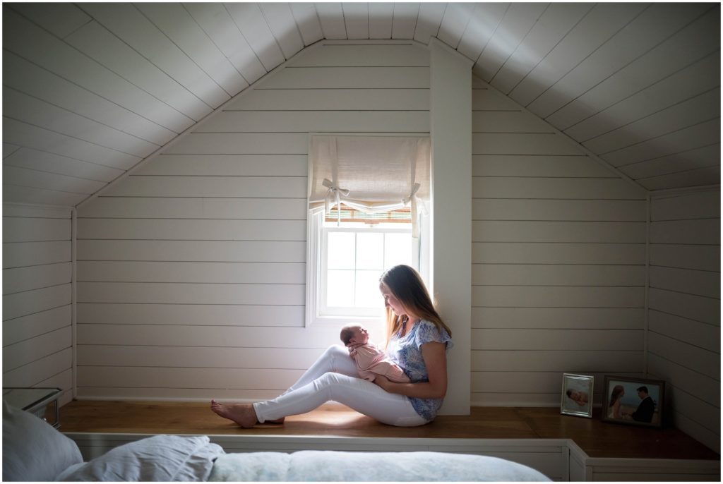 Mom holding baby in lifestyle newborn session