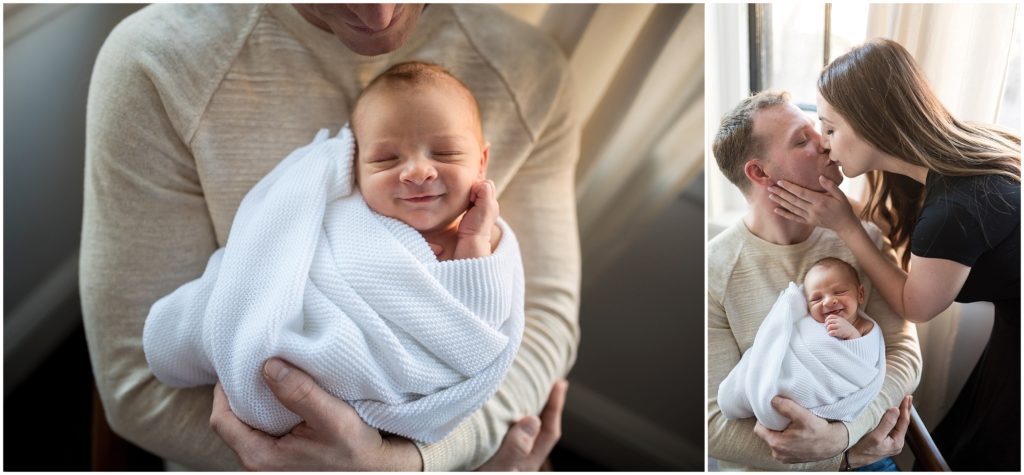 Newborn being held by father