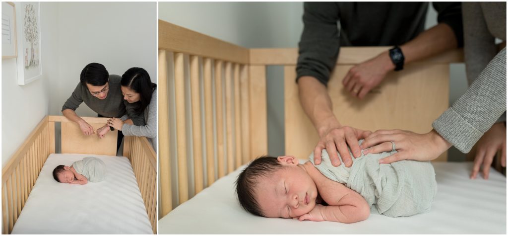 Parents looking at son in crib in his nursery in Boston