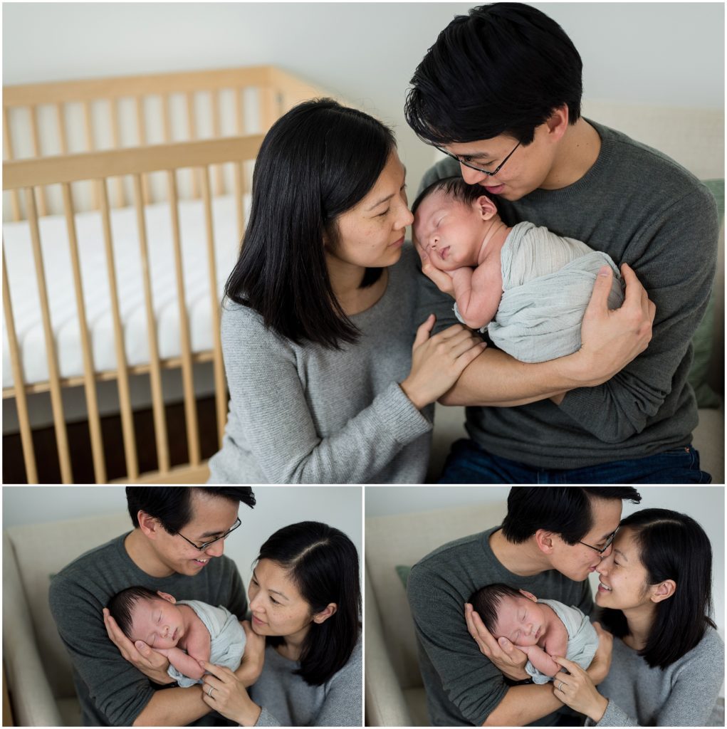 Parents holding newborn son in nursery