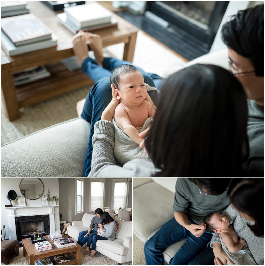 Newborn looking at parents while being held in living room at home during lifestyle session in Cambridge