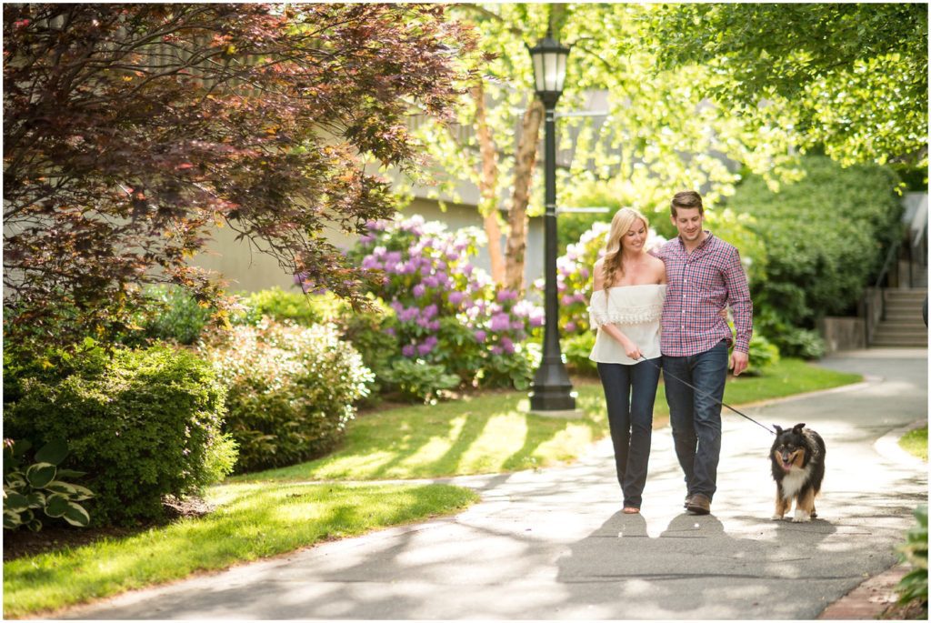 engaged couple walking with dog what to wear for boston photo session