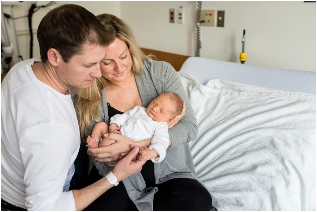 Beautiful parents holding their newborn at Boston hospital