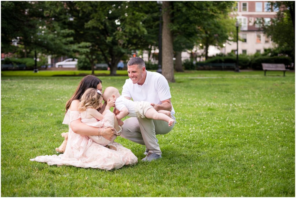 Kisses for baby brother during family session at Boston Public Garden