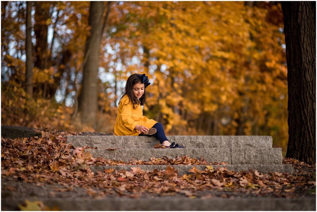 Girl sitting on steps in Larz Anderson Park