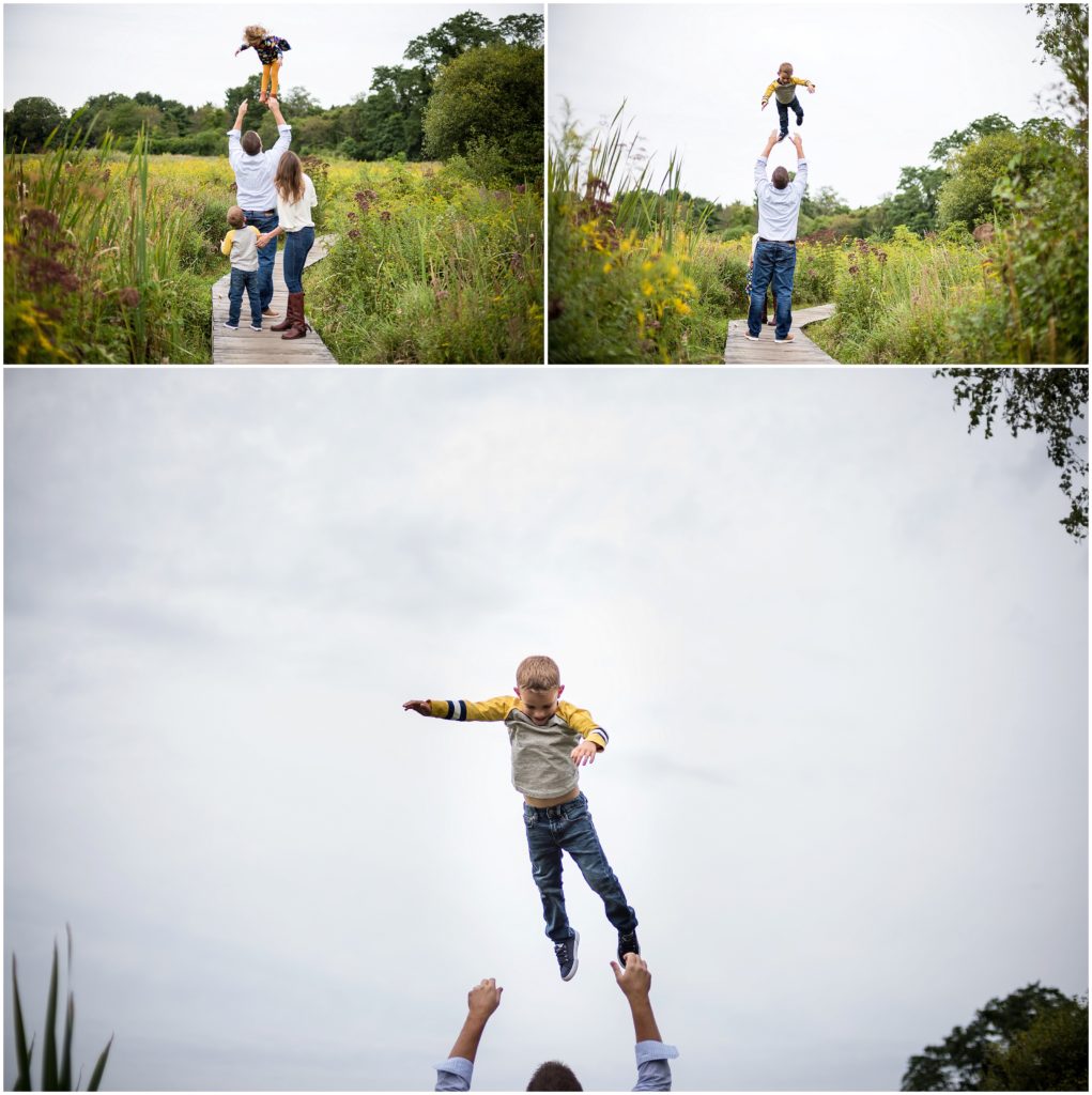 Dad throwing children in sky in Belmont