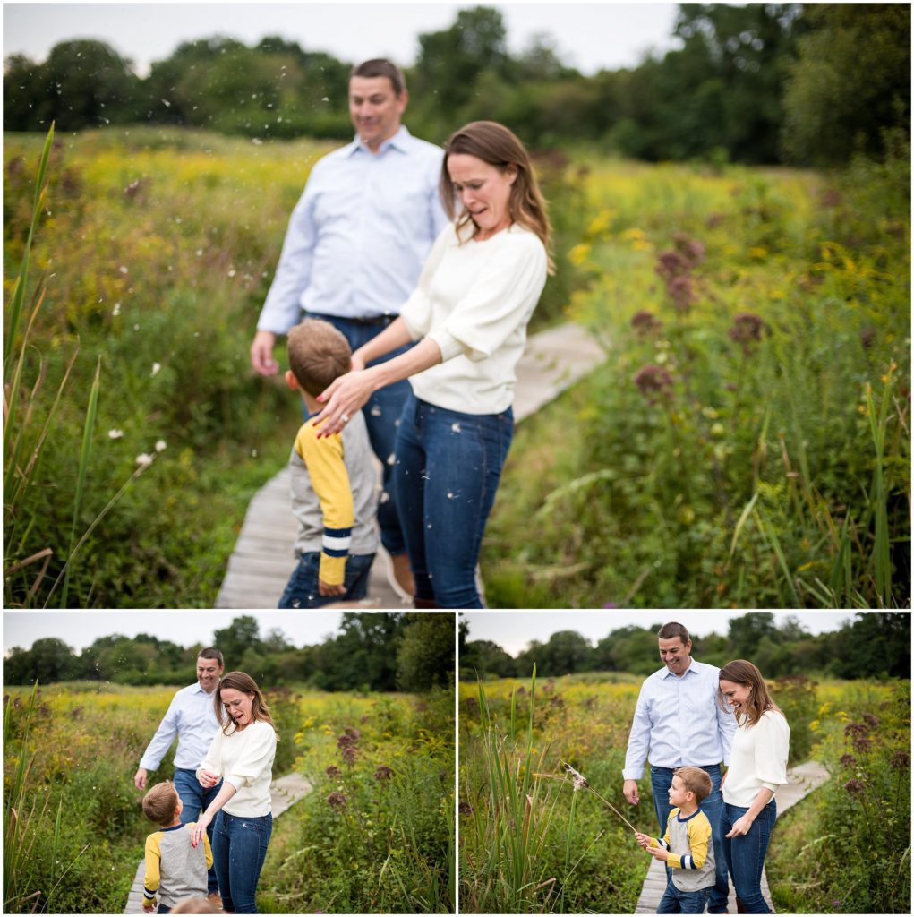 Family playing in field in family photography session