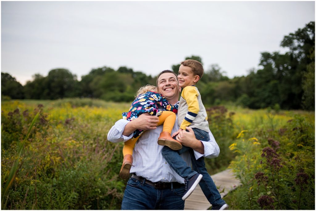 Dad getting hugs from children