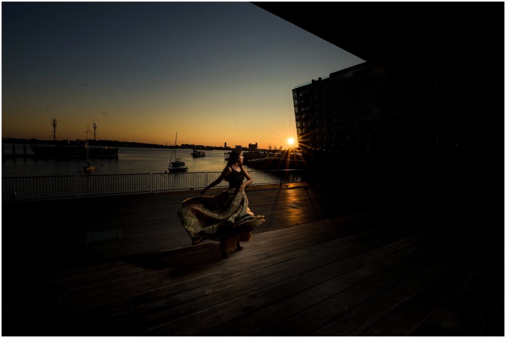 Sunrise over the ICA Boston with dancer in foreground