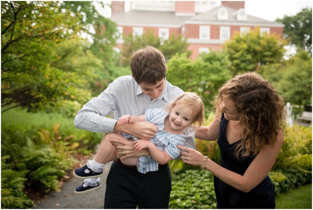 Parents playing with child in Harvard Yard Harvard family photography