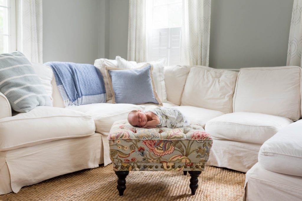Side-lying on ottoman | newborn photos at home