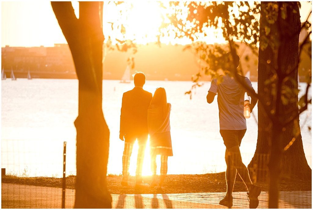 Couple about to propose during sunset on Charles River