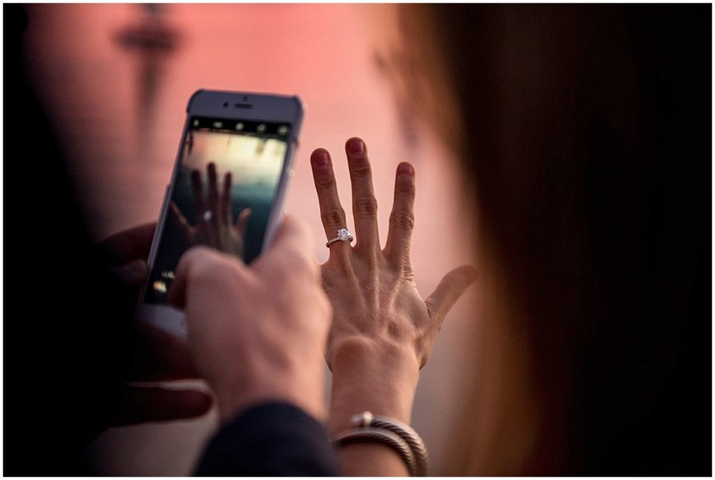 The engagement Ring being sent to friends and family during engagement session