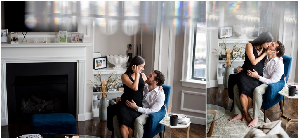 couple kissing on chair at home in Boston lifestyle maternity photography session