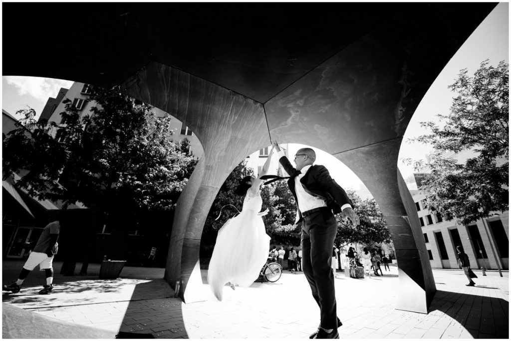 Couple jumping black and white wedding photo taken in MIT cambridge, MA