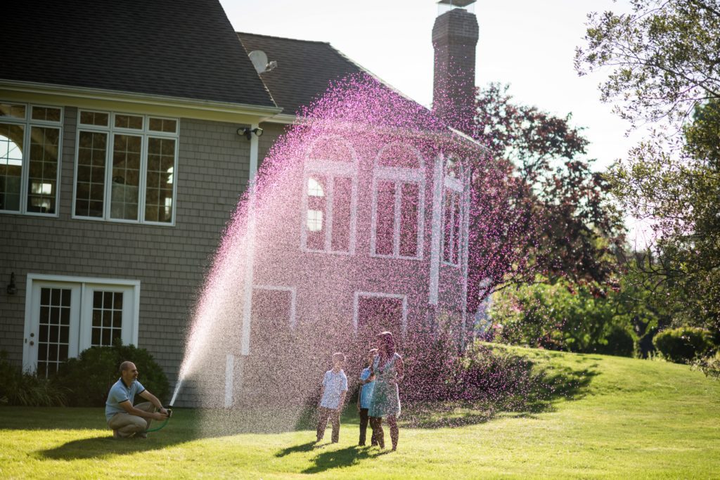 sprinkler at home family photography