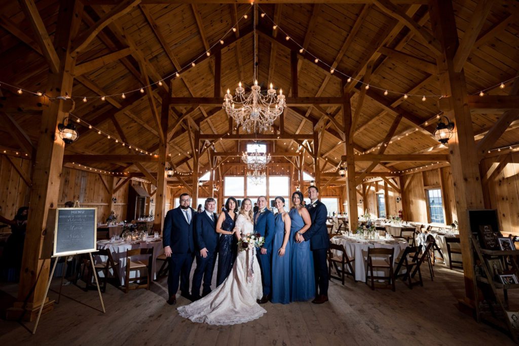 Formal family photos during wedding at reception barn