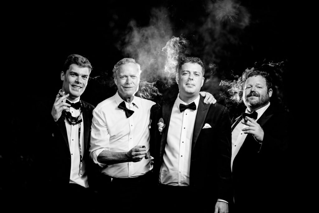 Groom and groomsmen brothers portraits with cigar