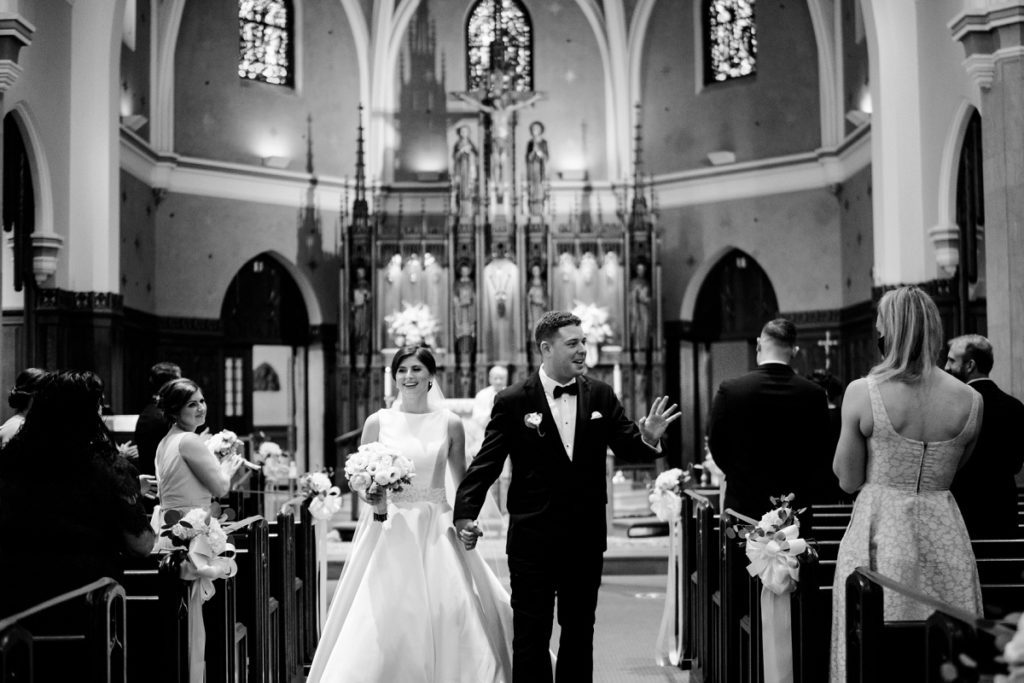 Bride and Groom exiting the church after the wedding