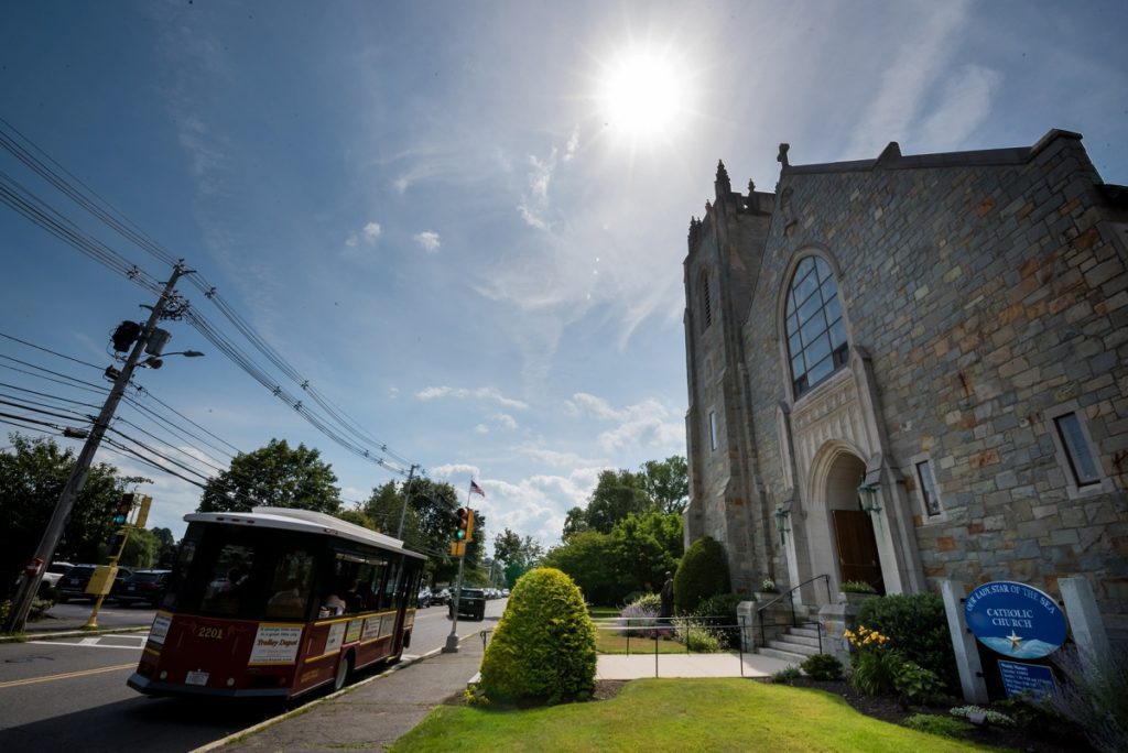 Couple on the trolley after wedding ceremony heading to reception