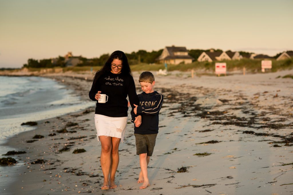 Quiet moment between a mother and sun on the beach in Cape cod during sunrise session