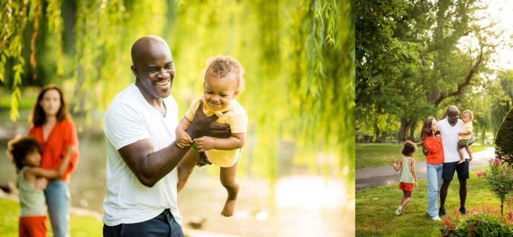 Father playing with child in the park in Boston Public Gardens with kids in cute outfits with flowers blooming
