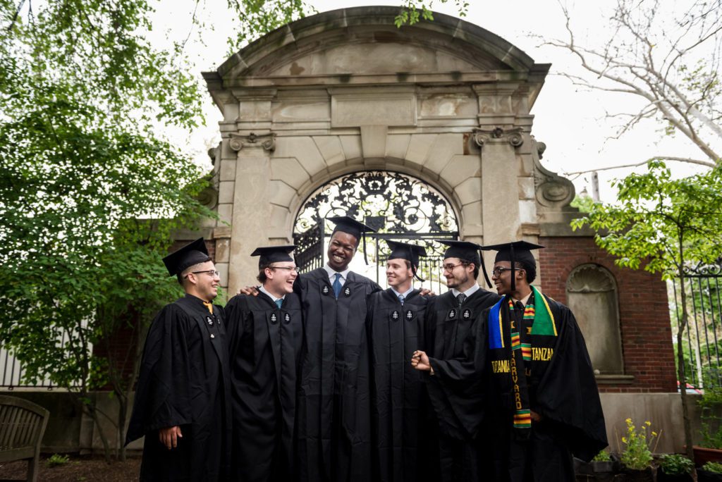 Harvard Grad with his friends in a picture on convocation day