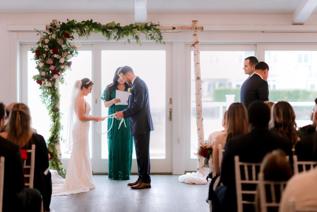 Wedding ceremony at the Ocean Room of Wychmere Beach Club