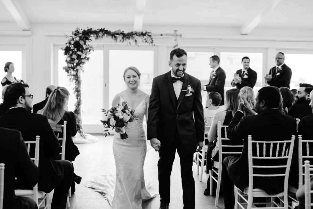 Newlyweds walking down the aisle