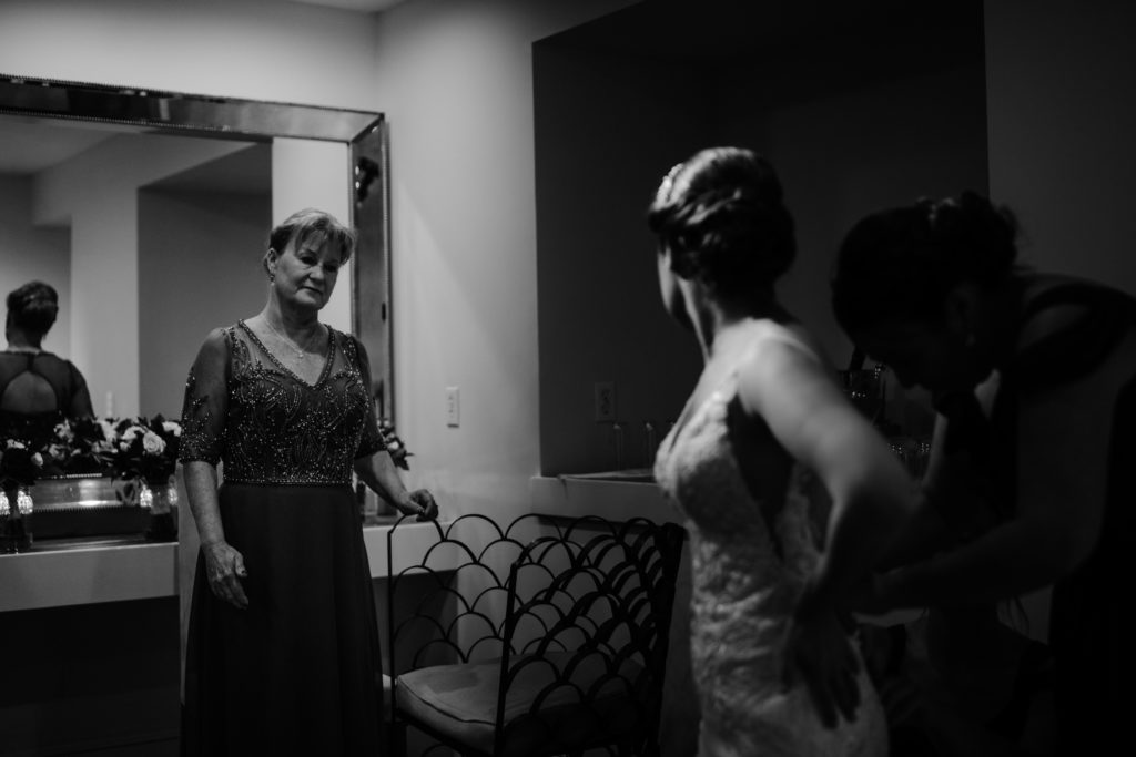 bride getting ready in the VIP bridal prep room of Wychmere beach club wedding